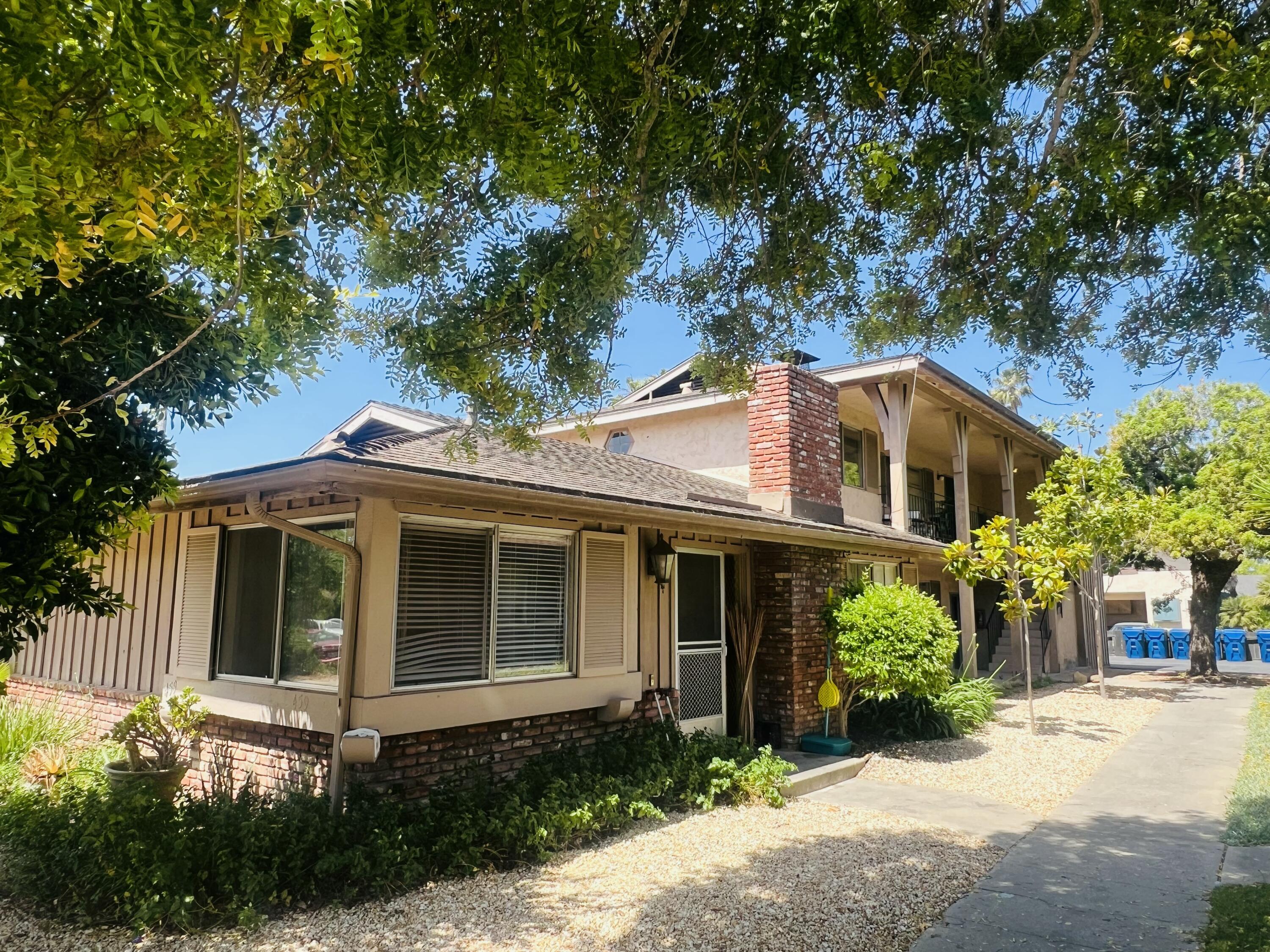 459 Linfield Place Goleta, CA 93117 - Photo 1 of 17 a front view of a house with a yard and potted plants