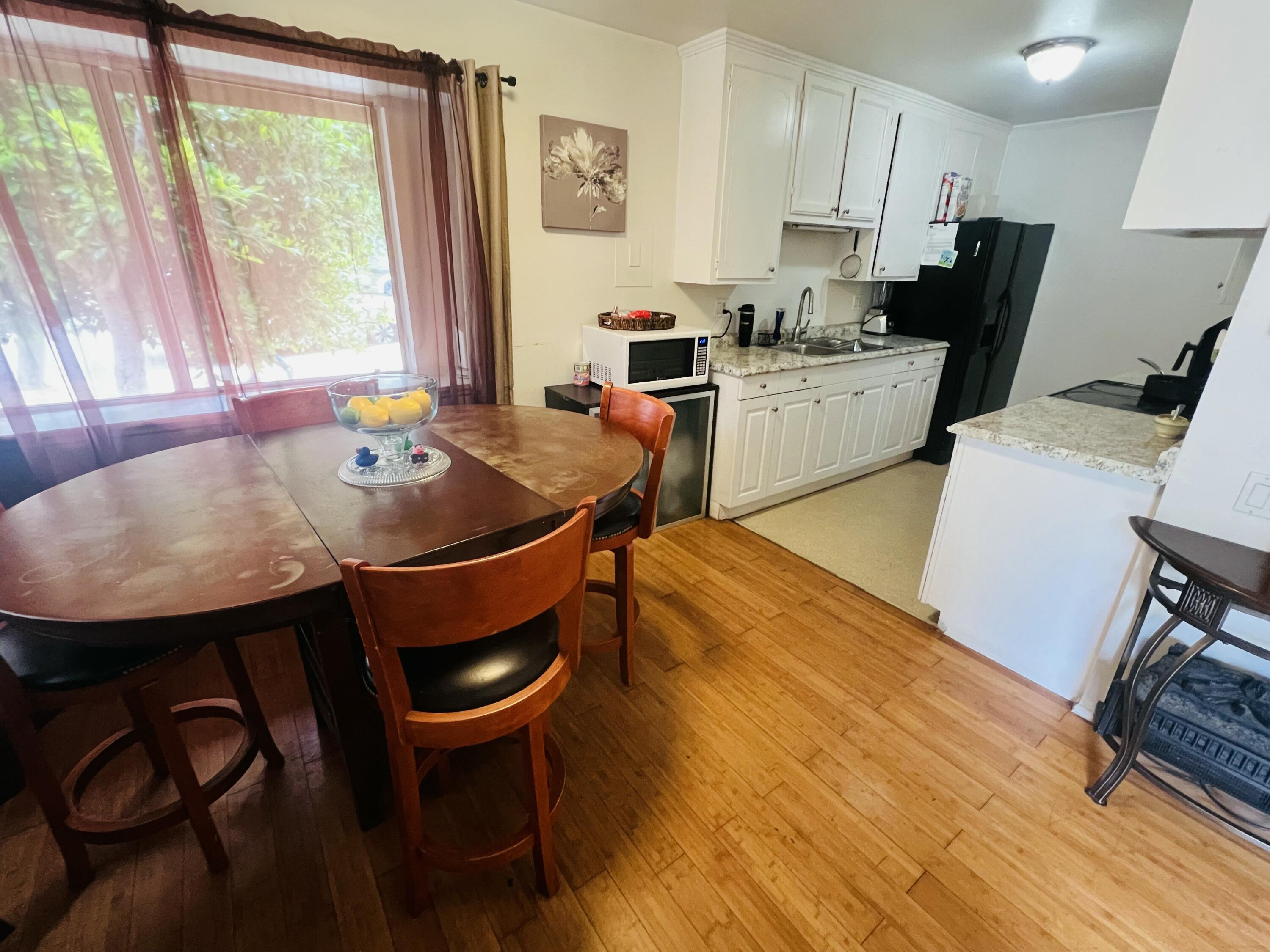 459 Linfield Place Goleta, CA 93117 - Photo 11 of 17 a dining room with furniture and wooden floor