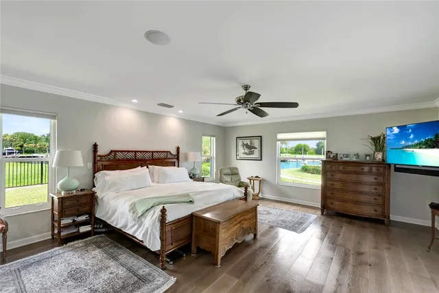 a bedroom with furniture and a flat screen tv