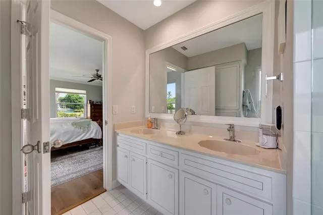 a bedroom with a bed chair and window