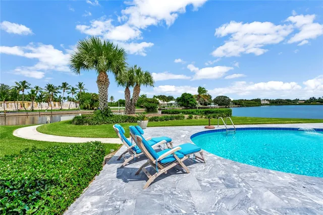 a view of a lake with houses in the back