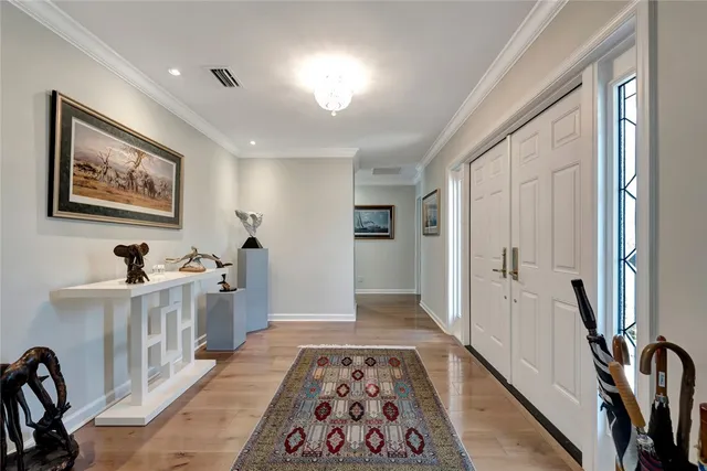 a hallway with a white stove top oven and furniture