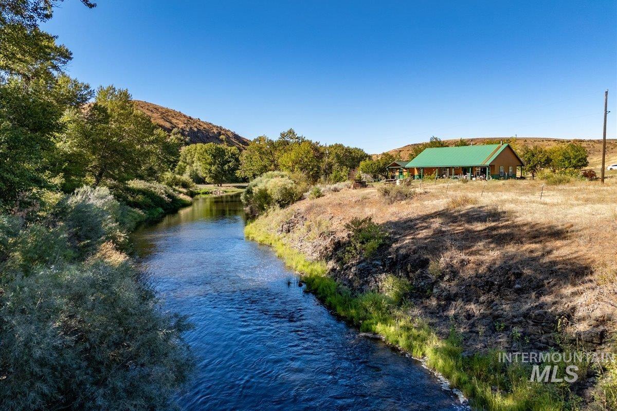 2128 Jackson Creek Road Council, ID 83612 - Photo 2 of 50 Water view with a mountain backdrop