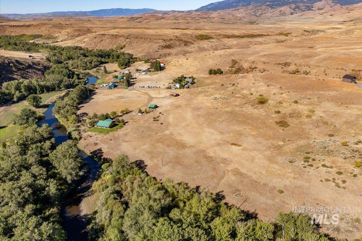 2128 Jackson Creek Road Council, ID 83612 - Photo 34 of 50 Aerial view of property's location with rural landscape and a mountain backdrop