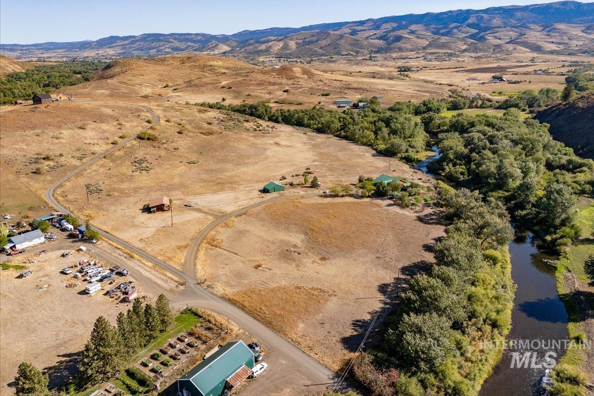 2128 Jackson Creek Road Council, ID 83612 - Photo 45 of 50 Aerial view of property and surrounding area with rural landscape and mountains