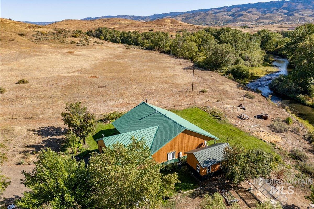 2128 Jackson Creek Road Council, ID 83612 - Photo 48 of 50 Aerial view of sparsely populated area featuring a mountain backdrop