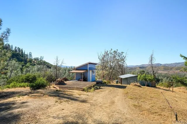 a view of a wooden fence next to a yard