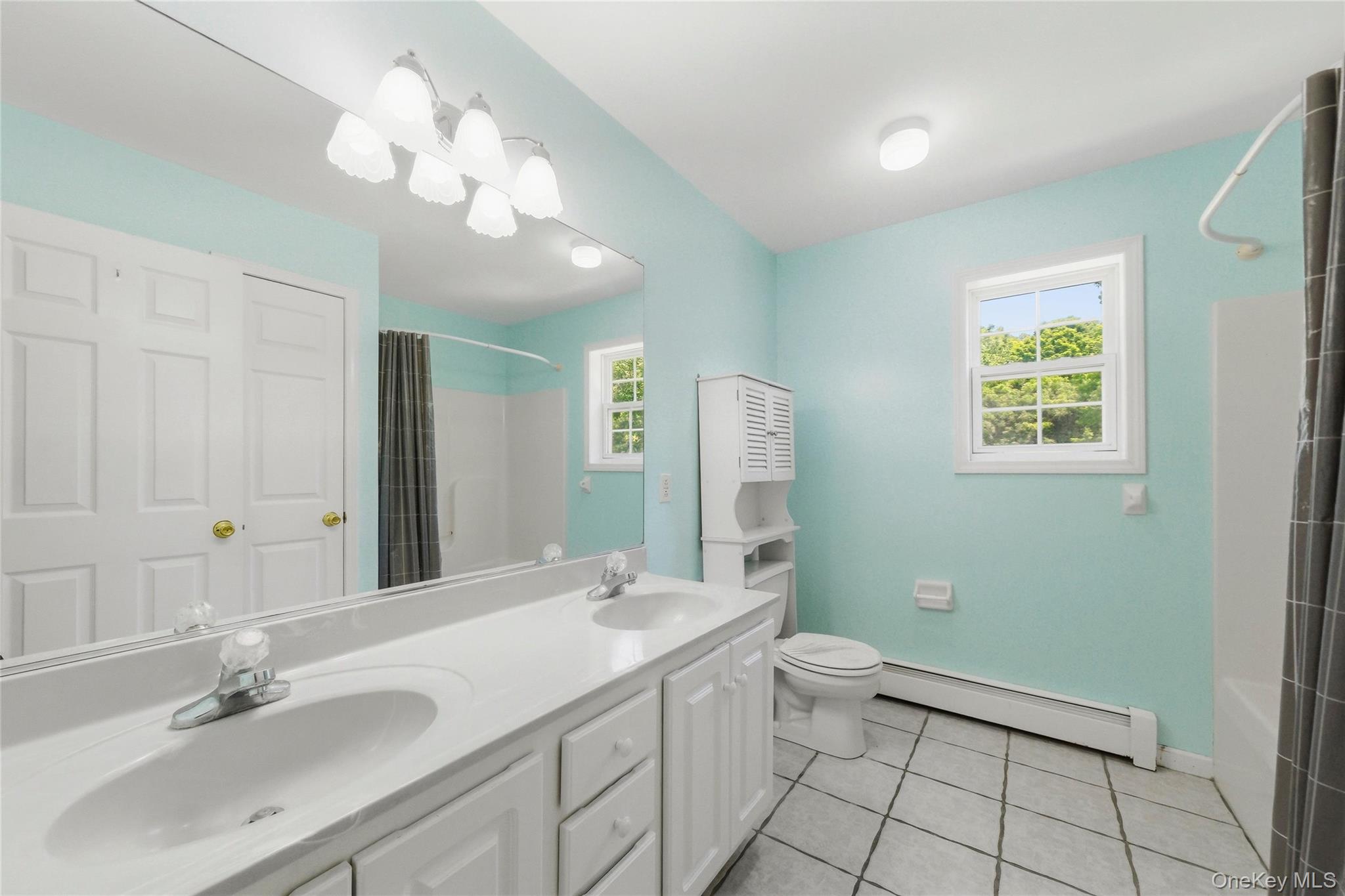 5 Horton Road Washingtonville, NY 10992 - Photo 23 of 42 a bathroom with a double vanity sink mirror and toilet