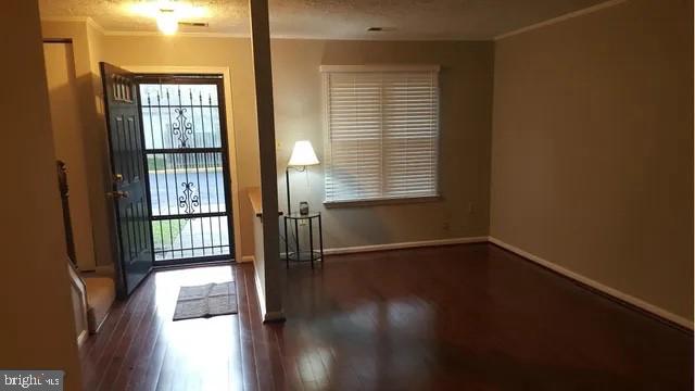 57 Riverside Run Drive Indian Head, MD 20640 - Photo 2 of 24 a view of an empty room with wooden floor and a window