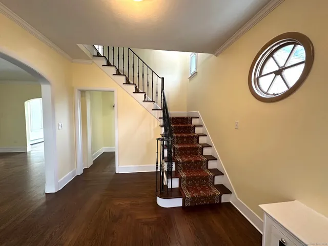 a view of entryway with wooden floor