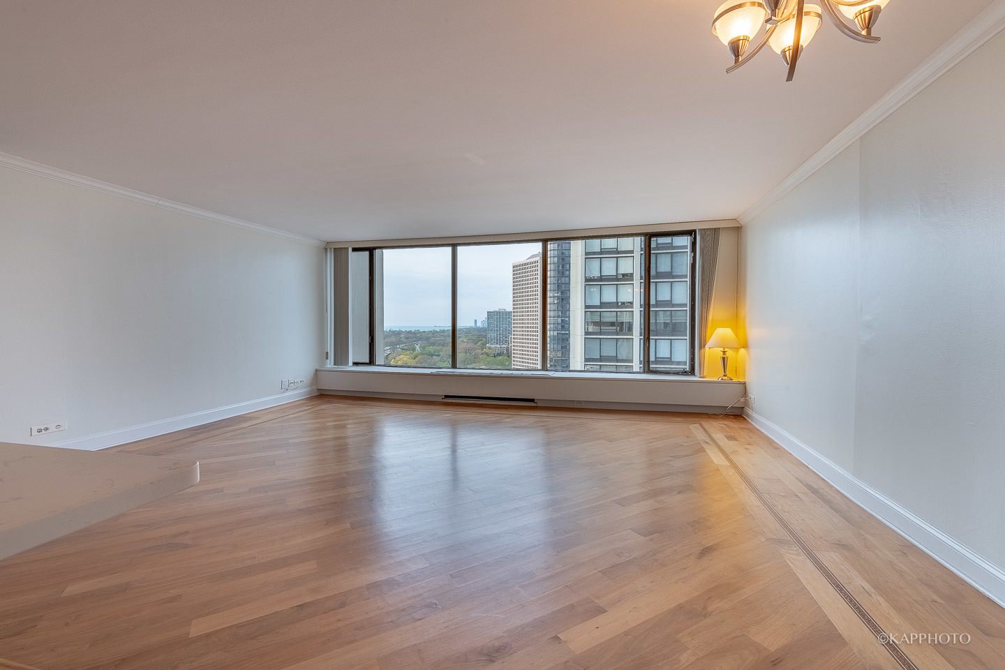 5455 North Sheridan Road, Unit 2008 Chicago, IL 60640 - Photo 3 of 35 wooden floor in an empty room with a window