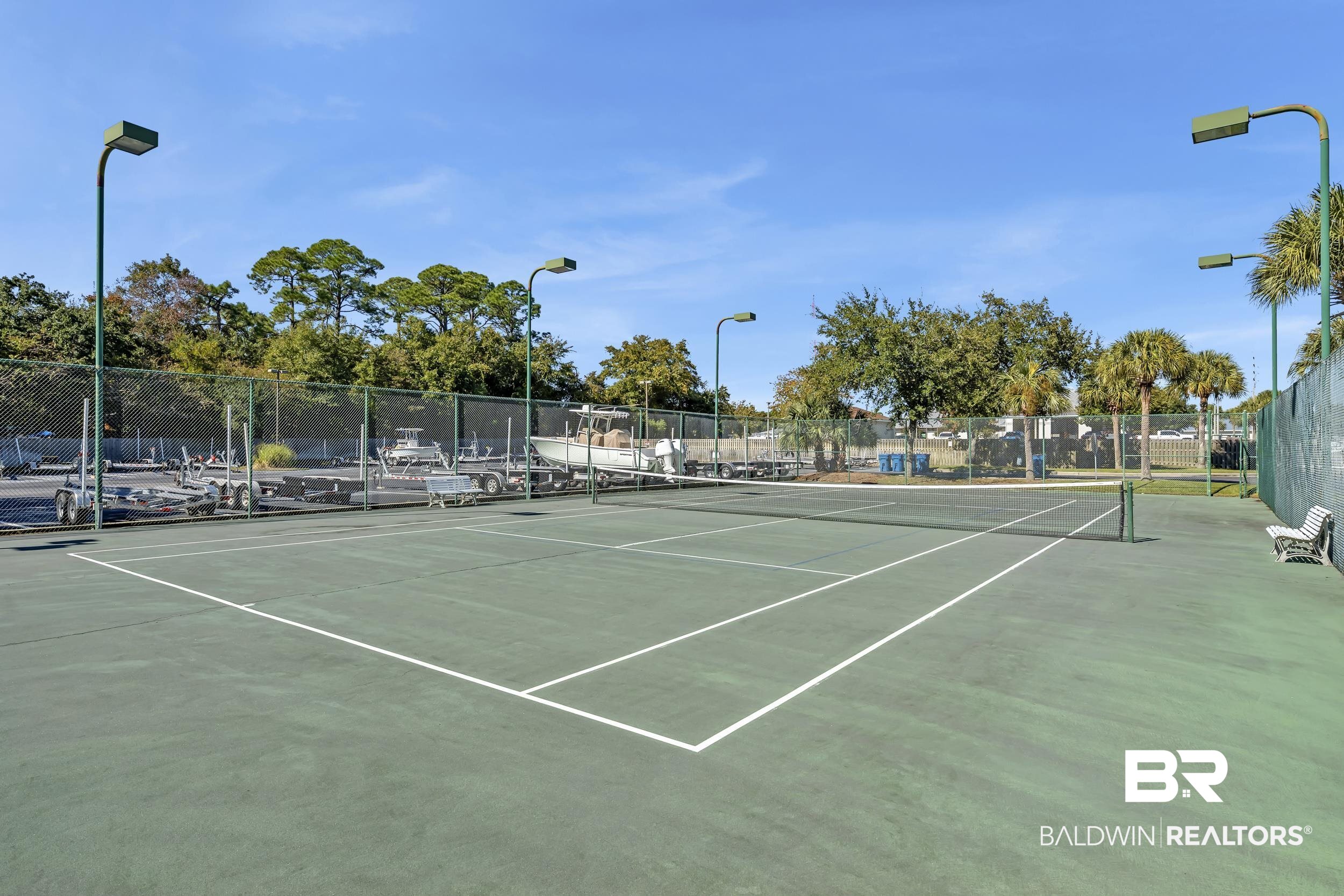 27282 Canal Road, Unit 104 Orange Beach, AL 36561 - Photo 64 of 79 View of tennis court with community basketball court