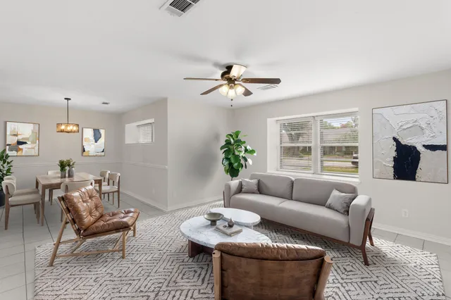 a living room with furniture and a window