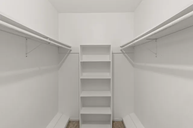 a view of an empty walk in closet