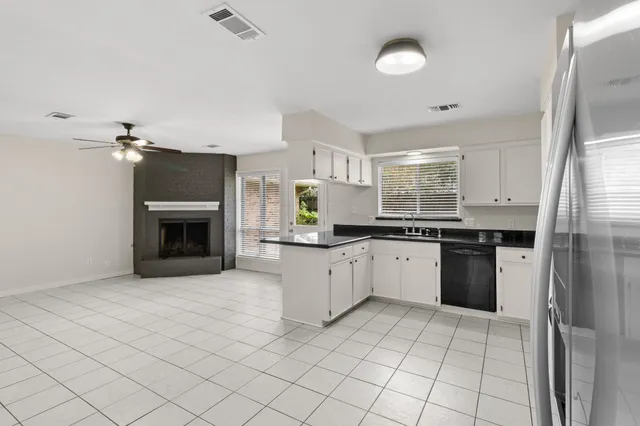 a kitchen with a sink cabinets and stainless steel appliances