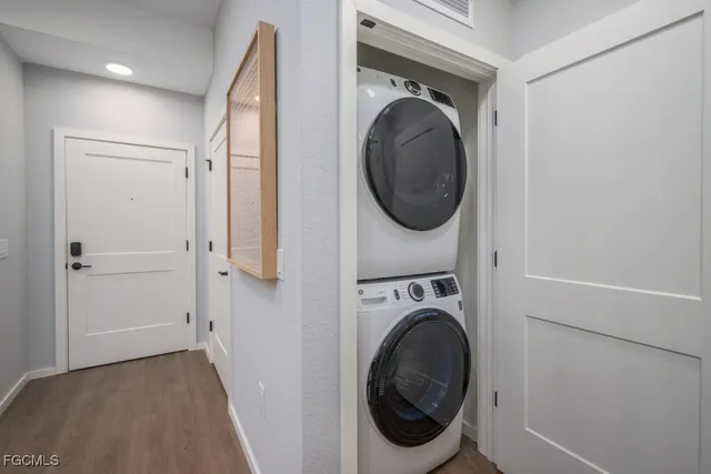a view of a hallway with washer and dryer