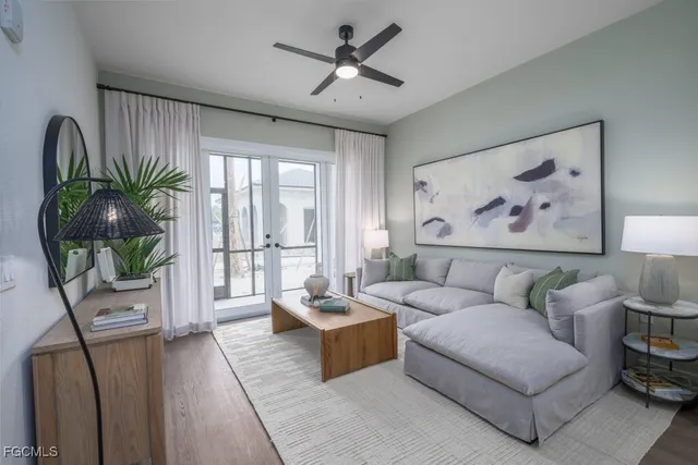 a living room with furniture and a large window