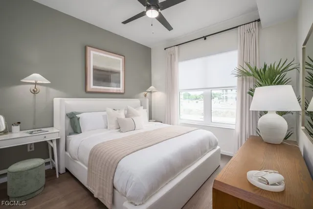 a bedroom with a bed and window