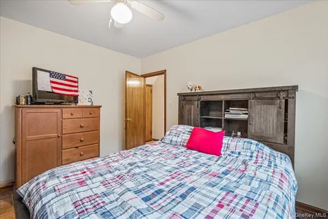 a bedroom with a bed and a couch