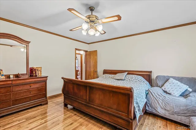 a bed room with a bed and a chandelier