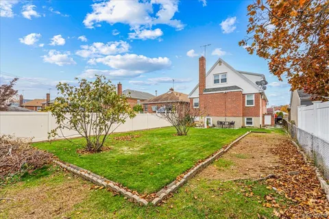 a view of a front of a house with a yard