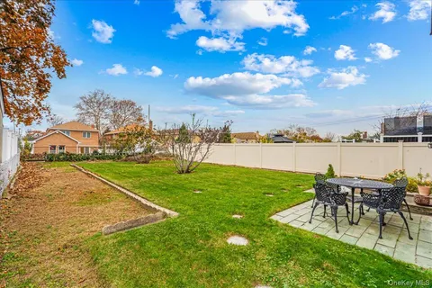 a view of a chairs and table on the garden