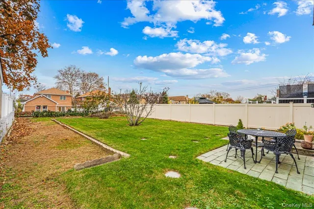 a view of a chairs and table on the garden