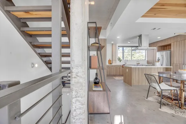 a view of staircase with white walls and windows