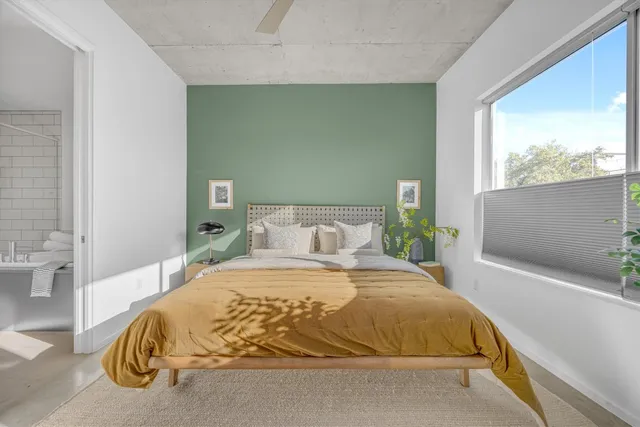 a bathroom with a tub and shower