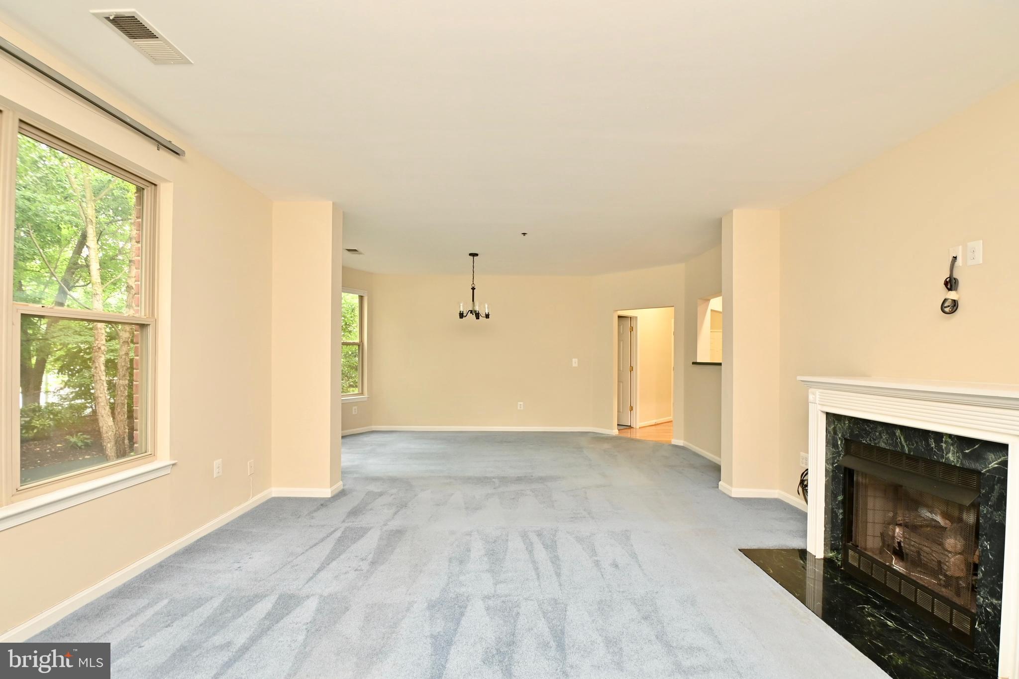 11775 Stratford House Place, Unit 104 Reston, VA 20190 - Photo 13 of 34 a view of an empty room with window and fire place