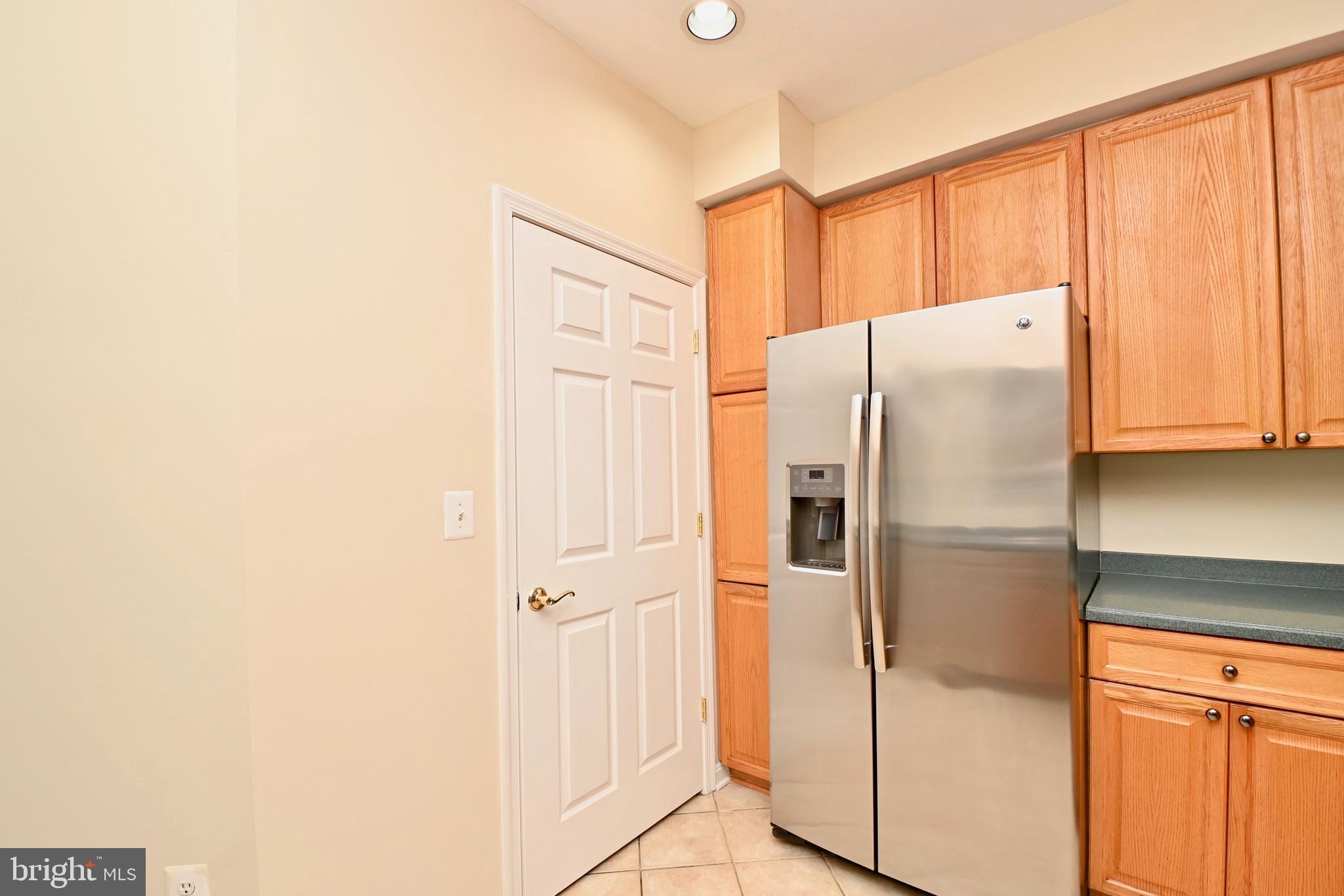 11775 Stratford House Place, Unit 104 Reston, VA 20190 - Photo 17 of 34 a white refrigerator freezer sitting inside of a kitchen