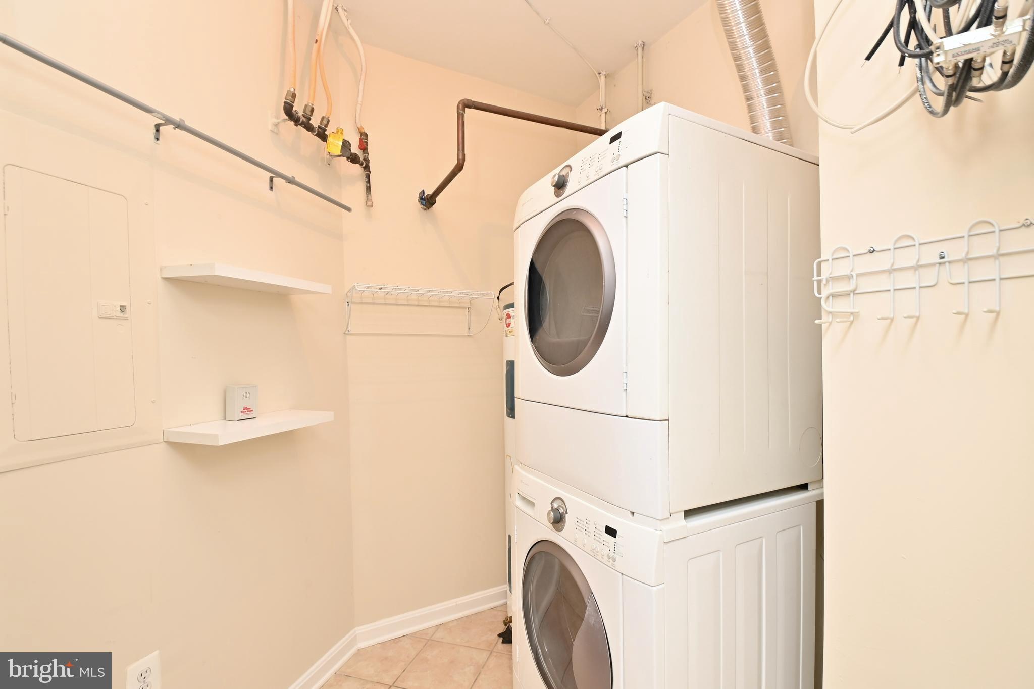 11775 Stratford House Place, Unit 104 Reston, VA 20190 - Photo 20 of 34 a utility room with dryer and washer