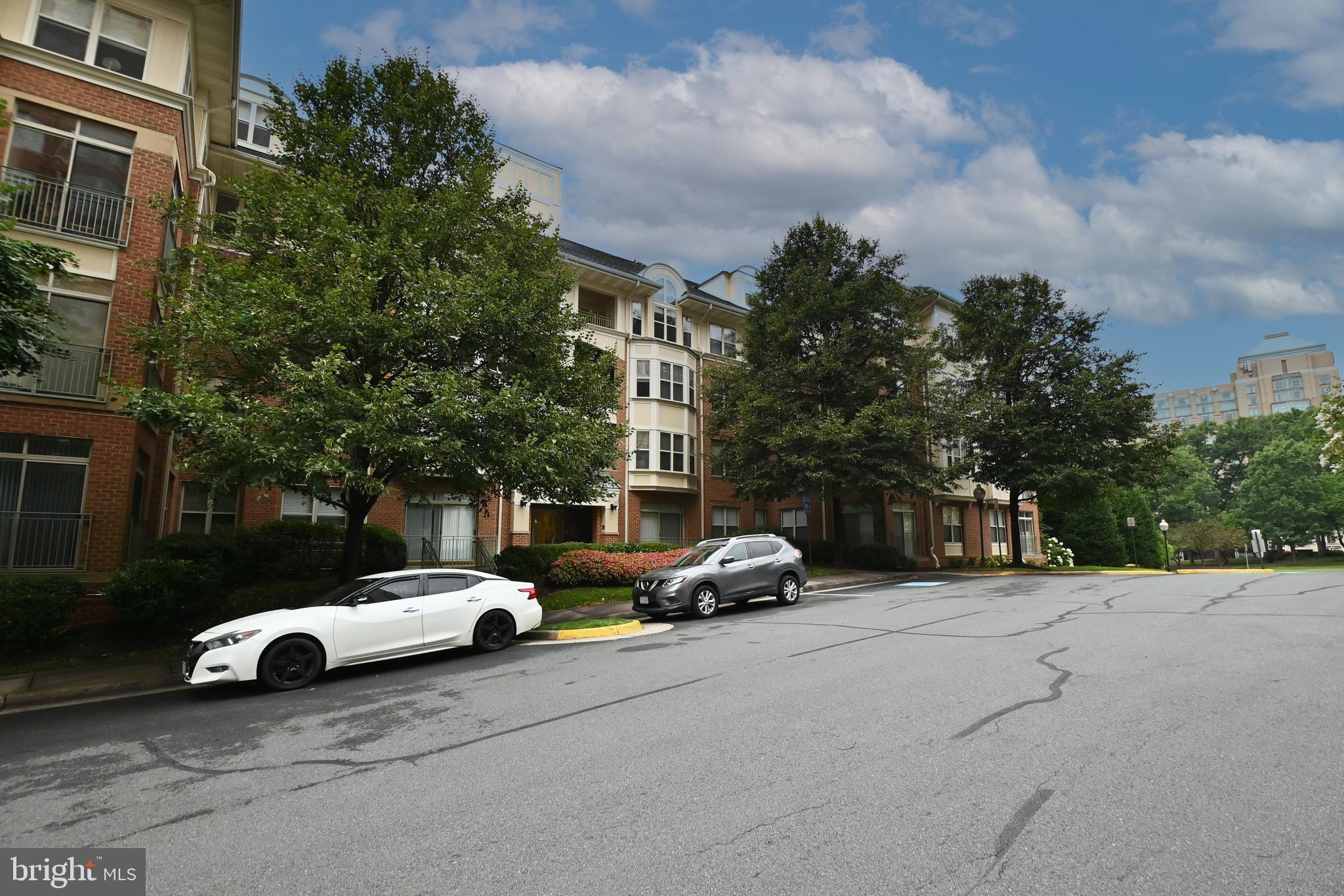 11775 Stratford House Place, Unit 104 Reston, VA 20190 - Photo 2 of 34 a car parked on the side of a street