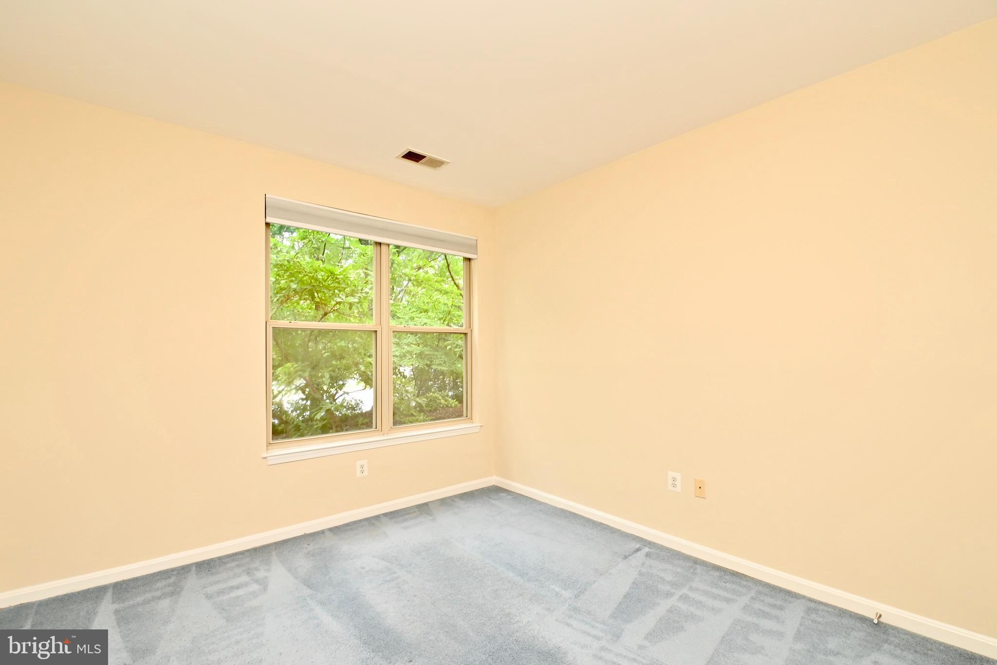 11775 Stratford House Place, Unit 104 Reston, VA 20190 - Photo 21 of 34 an empty room with a window