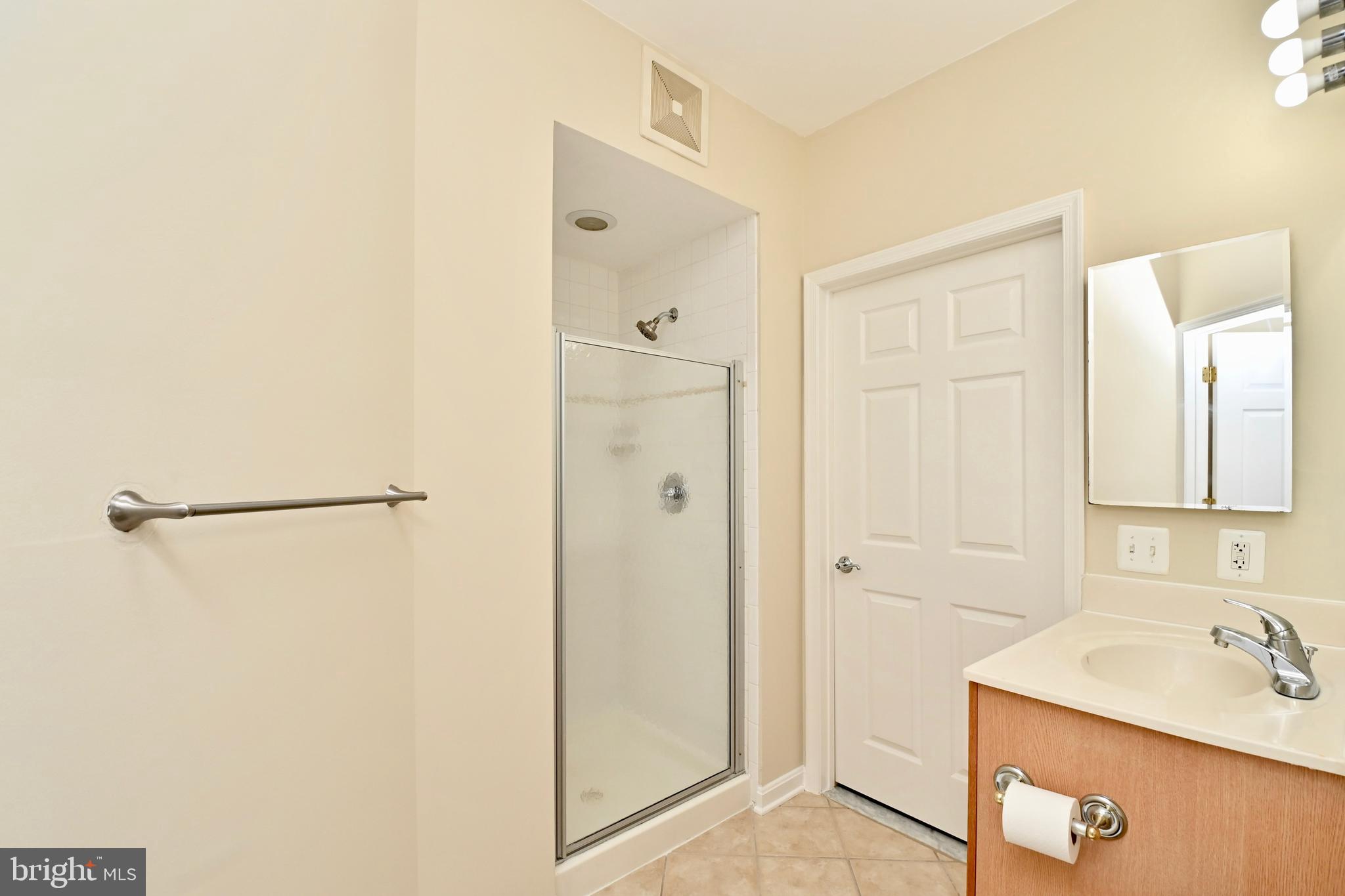 11775 Stratford House Place, Unit 104 Reston, VA 20190 - Photo 23 of 34 a bathroom with a sink and a shower