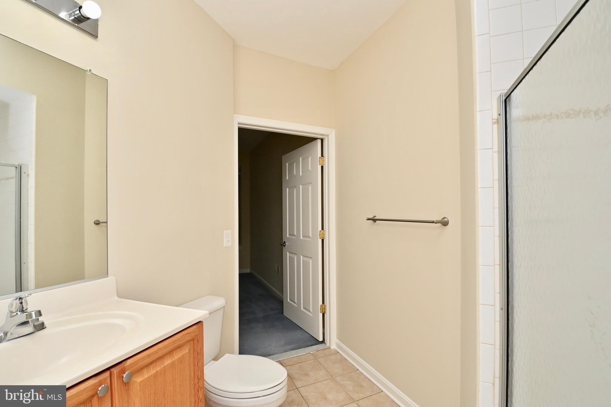 11775 Stratford House Place, Unit 104 Reston, VA 20190 - Photo 24 of 34 a bathroom with a sink and a toilet