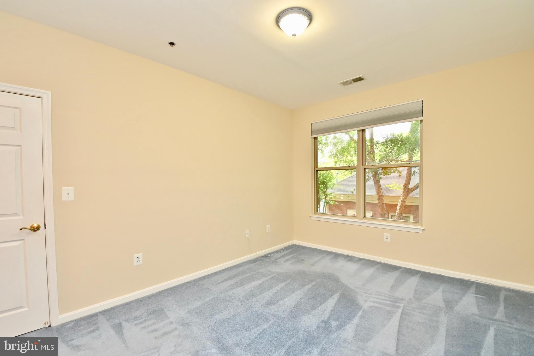 11775 Stratford House Place, Unit 104 Reston, VA 20190 - Photo 25 of 34 a view of an empty room with a window