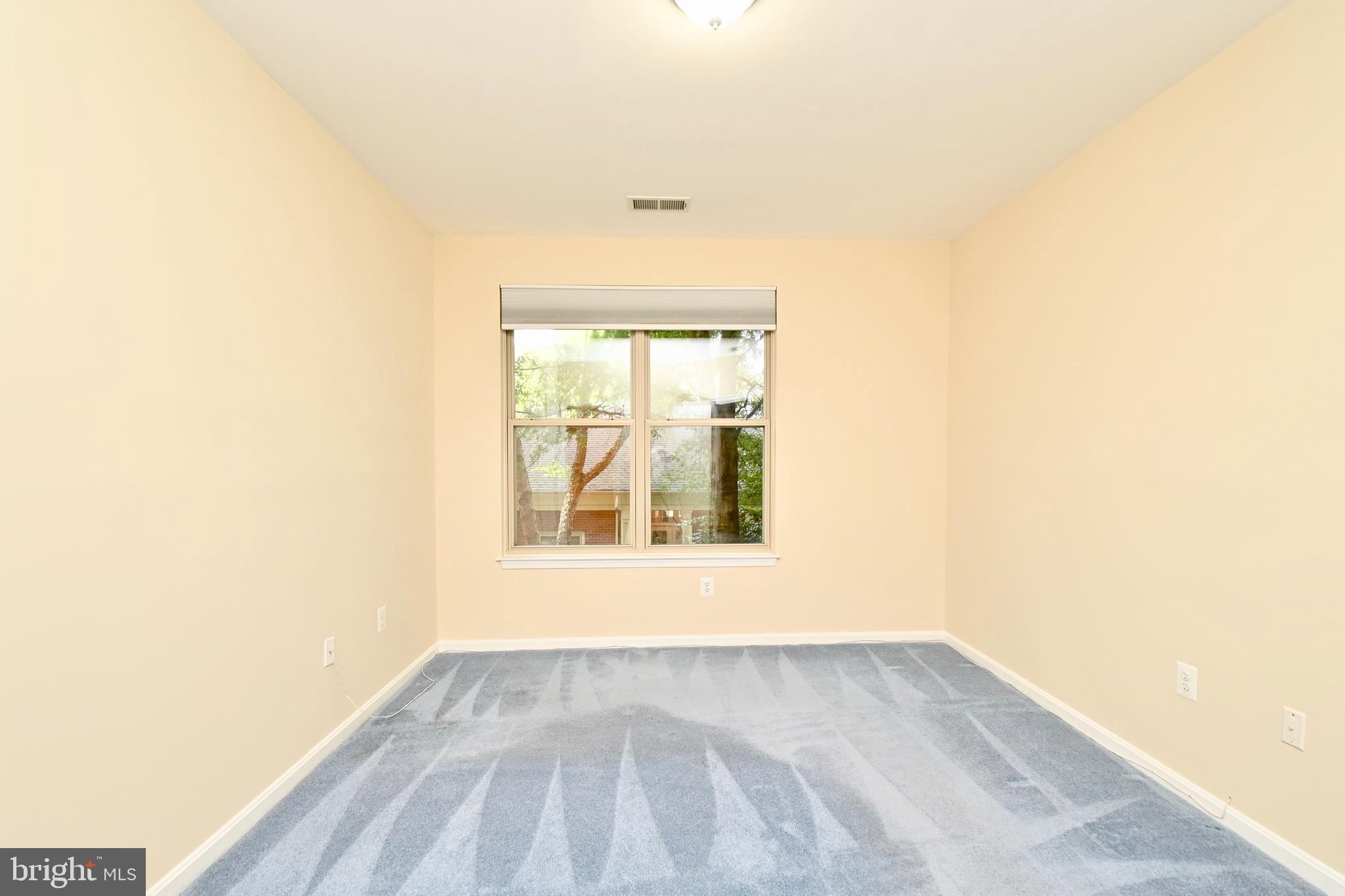 11775 Stratford House Place, Unit 104 Reston, VA 20190 - Photo 26 of 34 an empty room with a window