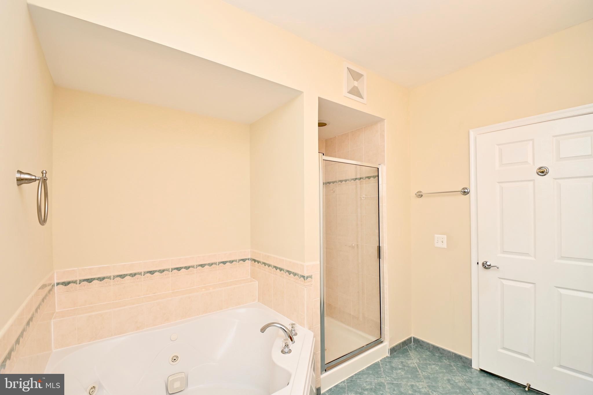 11775 Stratford House Place, Unit 104 Reston, VA 20190 - Photo 32 of 34 a bathroom with a shower