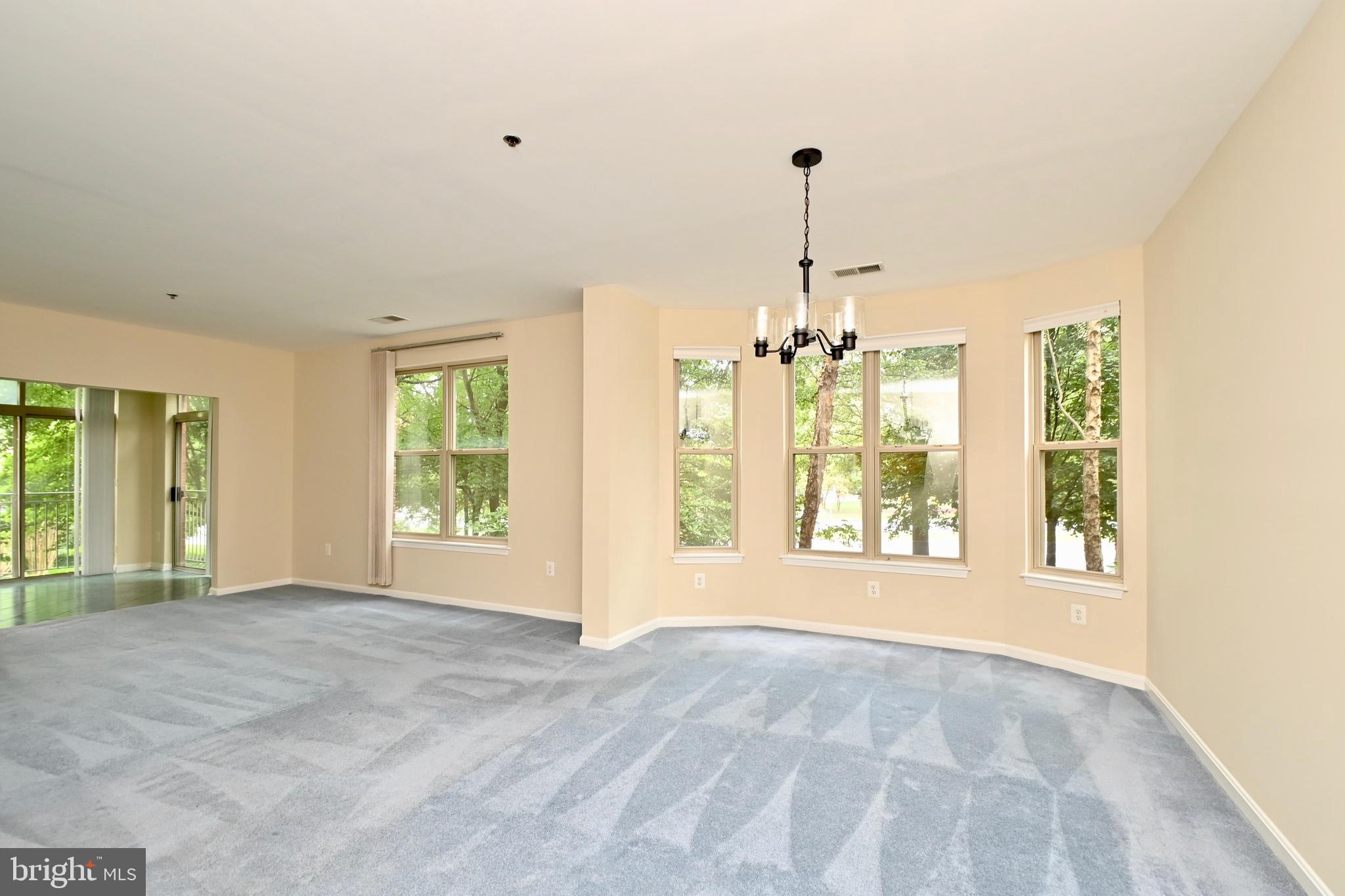 11775 Stratford House Place, Unit 104 Reston, VA 20190 - Photo 7 of 34 a view of an empty room with a window