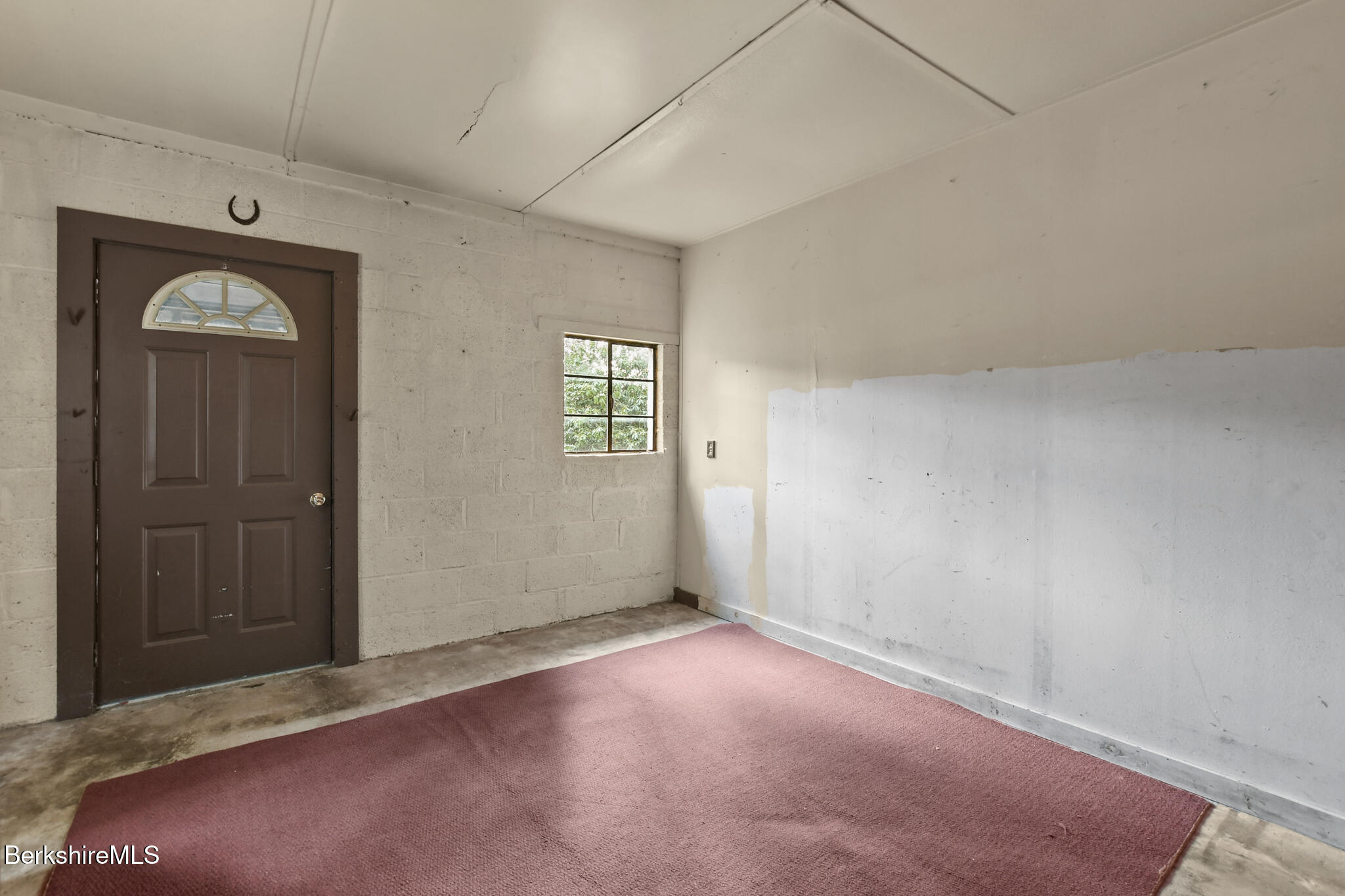 8 Tannery Road Sandisfield, MA 01255 - Photo 20 of 37 an empty room with windows and closet