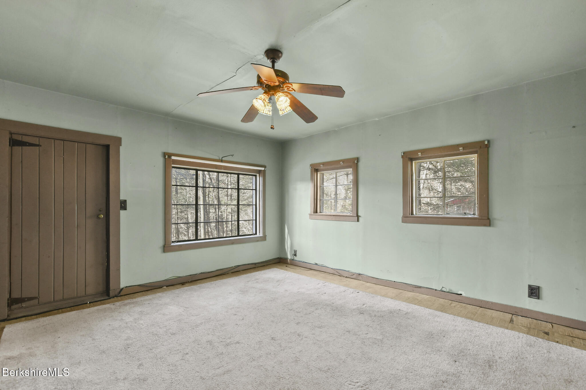 8 Tannery Road Sandisfield, MA 01255 - Photo 4 of 37 a view of an empty room with a window