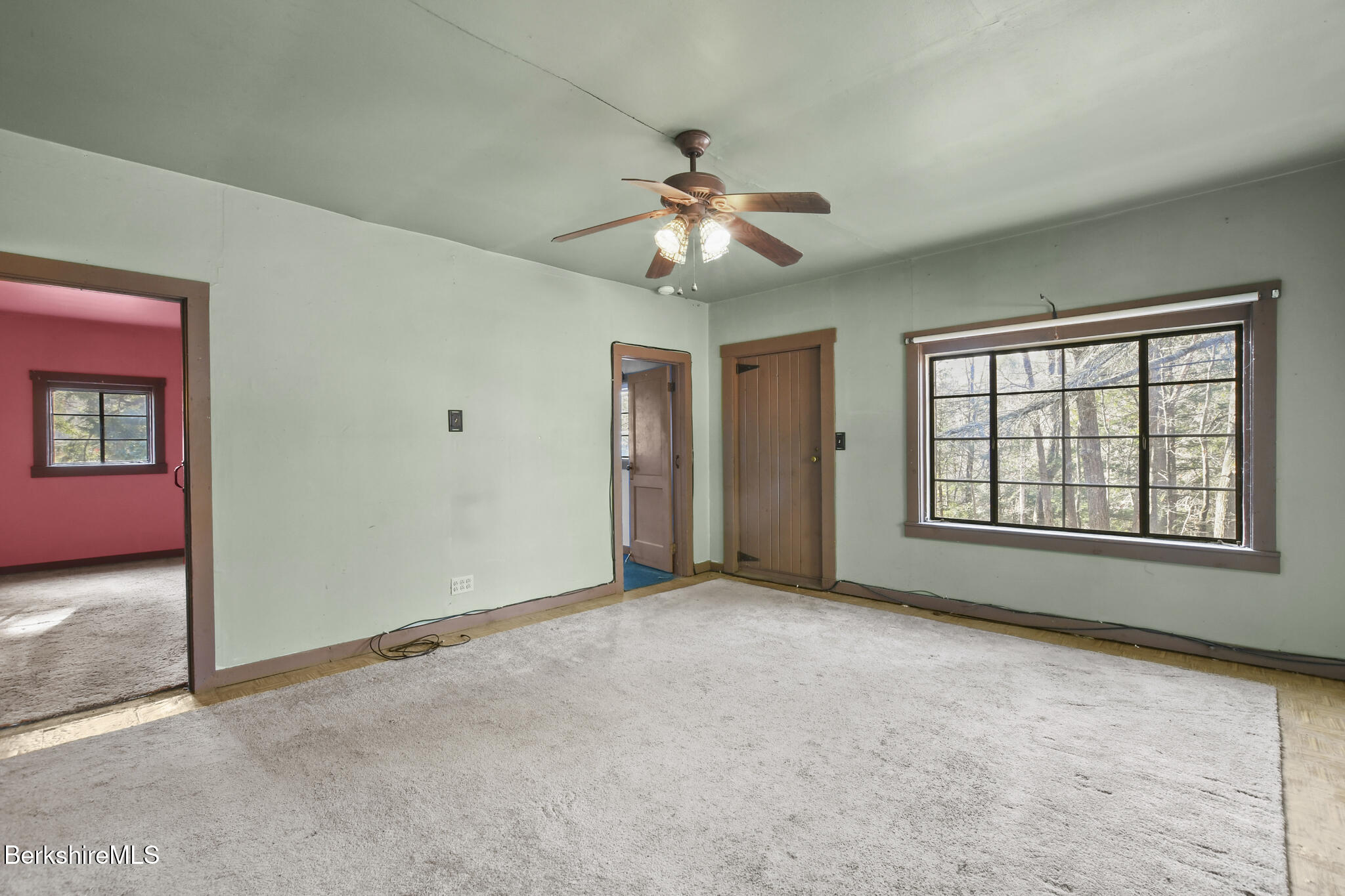 8 Tannery Road Sandisfield, MA 01255 - Photo 5 of 37 an empty room with chandelier fan and windows