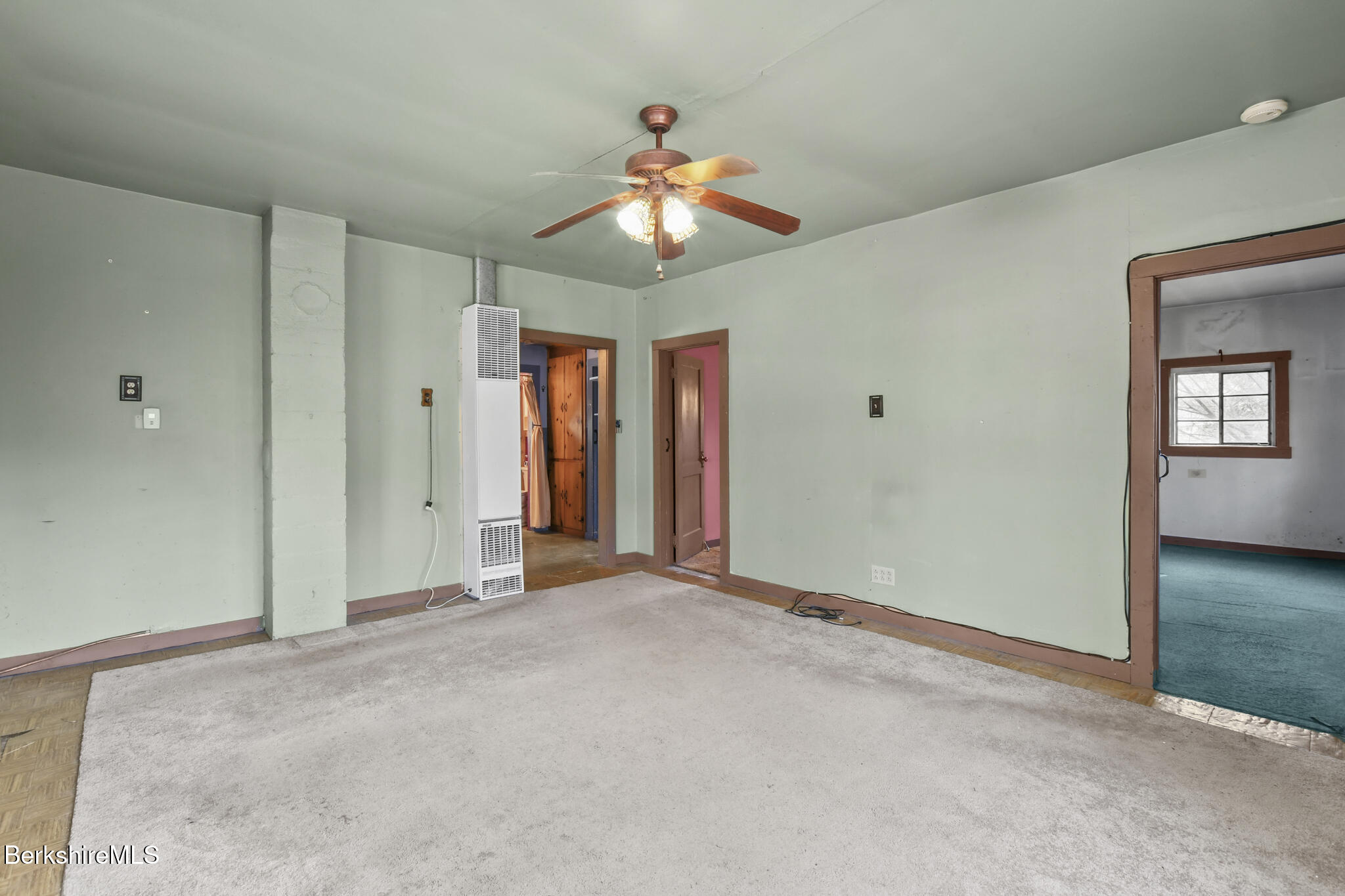 8 Tannery Road Sandisfield, MA 01255 - Photo 6 of 37 an empty room with closet and a chandelier fan