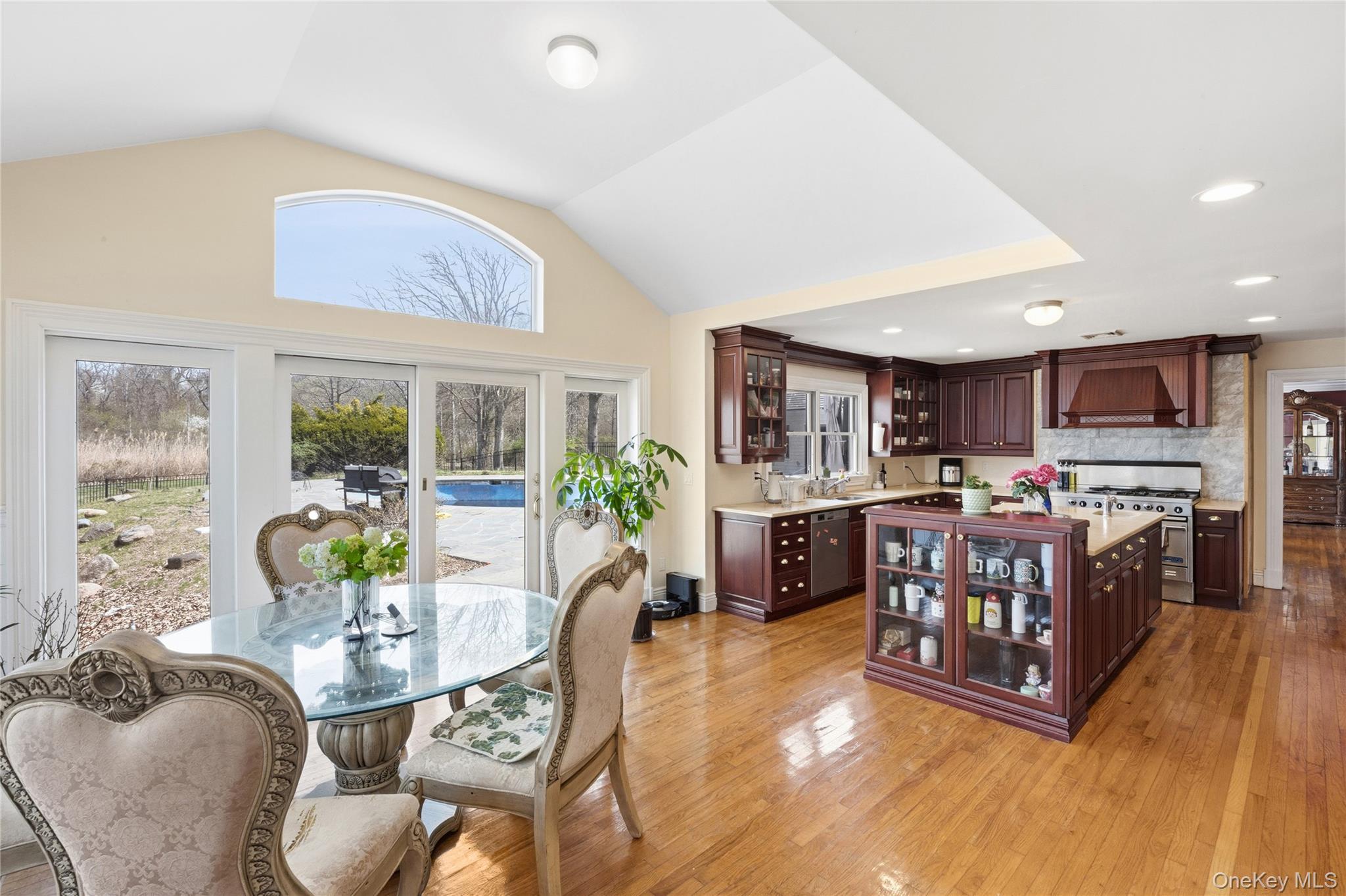 235 Centre Island Road Centre Island, NY 11771 - Photo 11 of 32 a living room with furniture a kitchen view and a large window