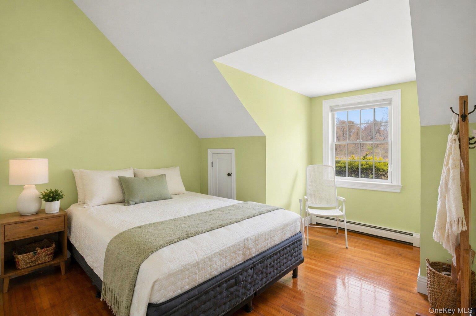 235 Centre Island Road Centre Island, NY 11771 - Photo 19 of 32 a bedroom with a bed and a window