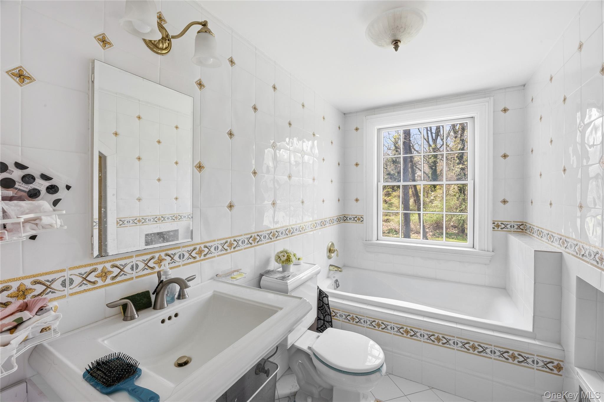 235 Centre Island Road Centre Island, NY 11771 - Photo 21 of 32 a bathroom with a sink and a bathtub