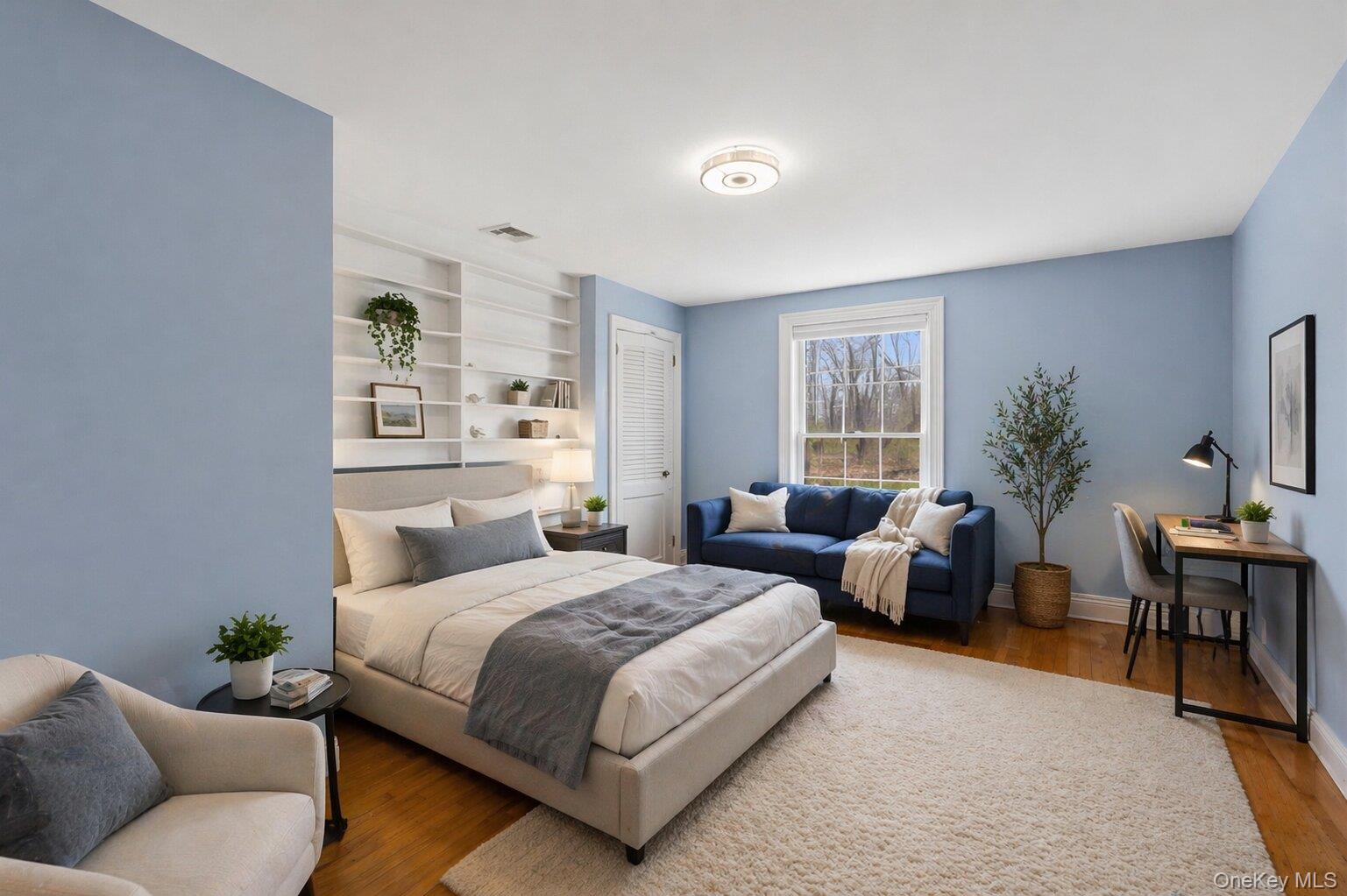 235 Centre Island Road Centre Island, NY 11771 - Photo 22 of 32 a bedroom with a large bed and a couch