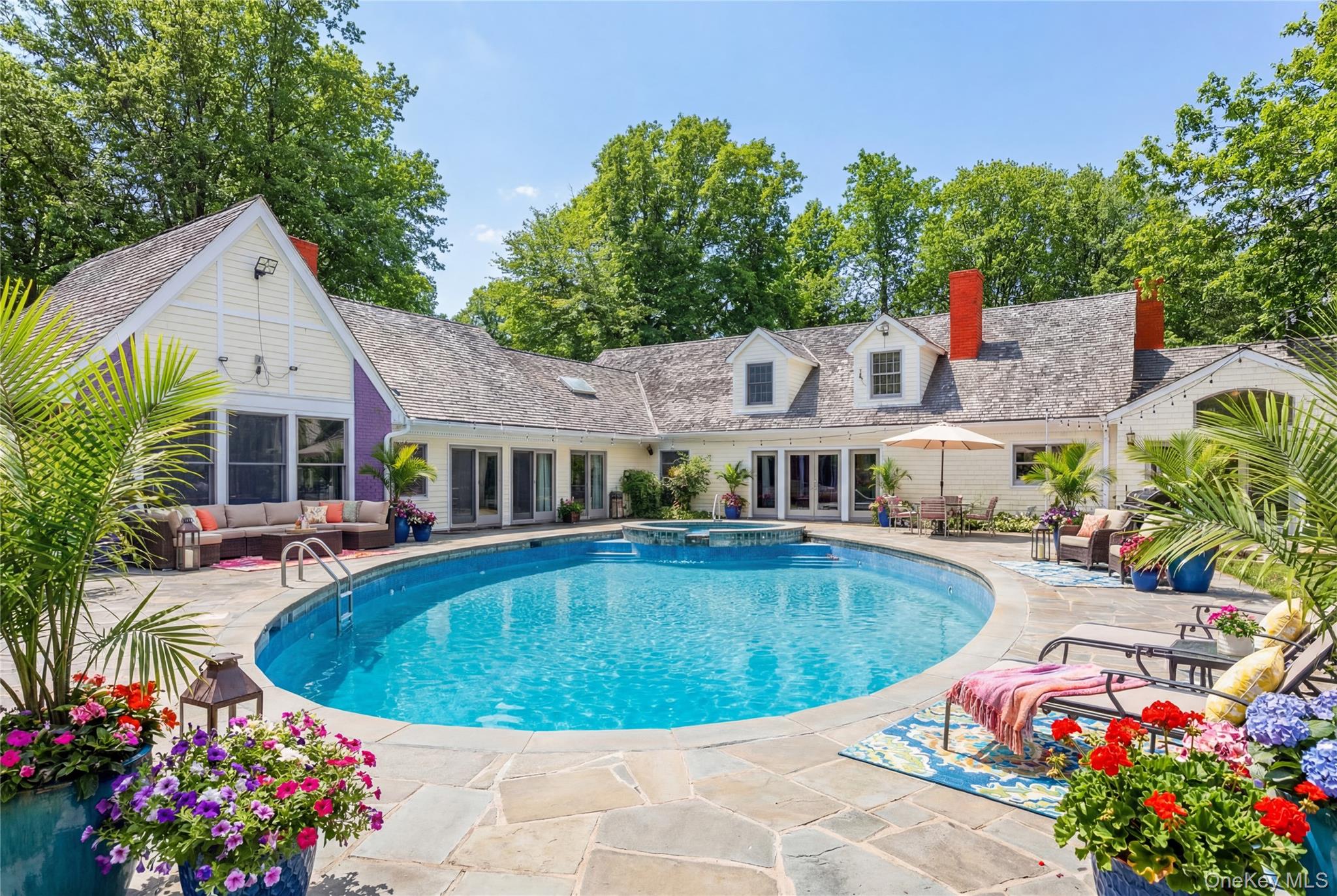 235 Centre Island Road Centre Island, NY 11771 - Photo 24 of 32 a view of a house with swimming pool and sitting area