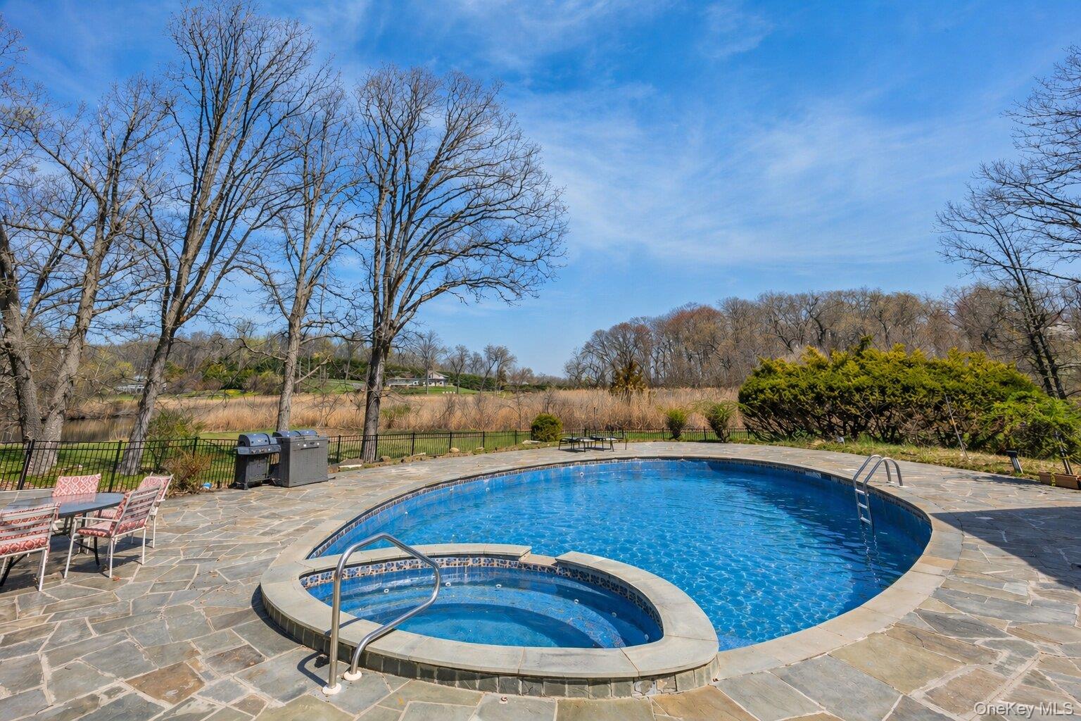 235 Centre Island Road Centre Island, NY 11771 - Photo 25 of 32 a view of a swimming pool with a patio